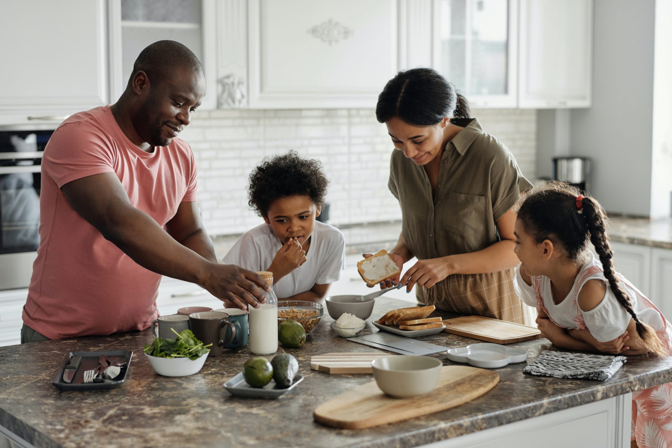 Family making breakfast together